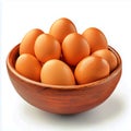 A rustic bowl filled with fresh brown eggs arranged in a cluster on a white background studio shot Royalty Free Stock Photo