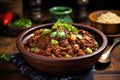 rustic bowl filled with hearty chili