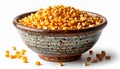 Rustic Bowl Full of Dried Yellow Corn Kernels Against White Background Royalty Free Stock Photo
