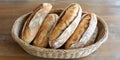 Rustic bread in handwoven basket flat lay. Perfect for artisan baking and kitchen decor Royalty Free Stock Photo