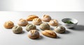 Rustic Bread Rolls Assortment with Pesto Dip on Clean White Surface, Studio Shot Royalty Free Stock Photo