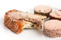 Rustic bread spread with pate, bite missing. Royalty Free Stock Photo