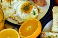 Rustic breakfast - roasted bread with butter and chives, fried eggs and bacon