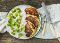 Rustic breakfast set with fluffy pancakes with strawberry yogurt