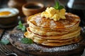 Rustic breakfast setup with a stack of pancakes, scrambled eggs, and a cup of black coffee. AI generated. Royalty Free Stock Photo