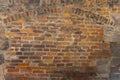 Rustic brick wall with ornamental arch in various sized cutouts as background