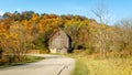 Rustic Brown Barn Amidst Fall Colored Trees