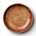 Rustic brown ceramic plate on a plain white surface view Royalty Free Stock Photo