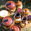 Rustic brown potteries and condiment container set at garage sale