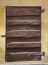 Rustic brown wooden window shutters Royalty Free Stock Photo