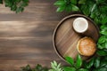 Rustic burger and beer setup with fresh greenery on wooden table Royalty Free Stock Photo