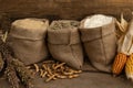 Rustic Burlap Sacks with Grains and Corn Royalty Free Stock Photo