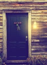 Rustic cabin door with porch light