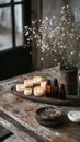 A rustic candle-making station with handmade candles and essential Royalty Free Stock Photo