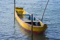 Rustic canoe docked in river Royalty Free Stock Photo