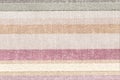 Rustic canvas fabric texture. Colored striped coarse linen fabric closeup as pattern background Royalty Free Stock Photo