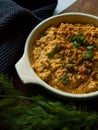 Rustic carrot hummus on wooden board Royalty Free Stock Photo