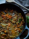 Rustic carrot and lentil curry in pot