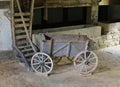 Rustic cart. Vintage wooden wagon in the stable.