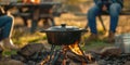 Rustic Cast Iron Dutch Oven cooking over an open BBQ fire Royalty Free Stock Photo