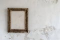 The rustic charm of an aged wooden picture frame hanging on a bare white wall Royalty Free Stock Photo