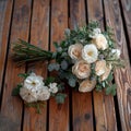 Rustic charm creamy roses, white carnations on a wooden floor