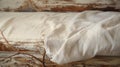 Rustic Charm: Satin Bed With Weathered Linen Sheets And Organic Sculpting