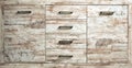 Rustic chest drawer of bleached pine wood. Close up, front view