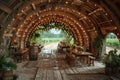 Rustic-chic barn converted into a wedding venue with string lights and wooden tables. Royalty Free Stock Photo