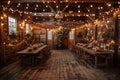 Rustic-chic barn converted into a wedding venue with string lights and wooden tables. Royalty Free Stock Photo