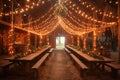 Rustic-chic barn converted into a wedding venue with string lights and wooden tables. Royalty Free Stock Photo