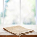 Rustic Chic: Wooden Table with a Napkin in Perspective. Canvas napkin with lace, tablecloth on wooden table on a sunny Royalty Free Stock Photo