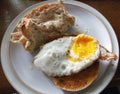 Unhealthy food : Rustic chicken sandwich with fried egg and bagel