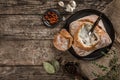Rustic chicken soup with mushrooms in bread with spices on rustic wooden background. Healthy food concept, top view, flat lay Royalty Free Stock Photo