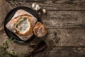 Rustic chicken soup with mushrooms in bread with spices on rustic wooden background. Healthy food concept, top view, flat lay, Royalty Free Stock Photo