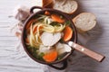 Rustic chicken soup with noodles closeup. Horizontal top view