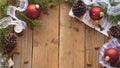 Rustic Christmas Flatlay of Pine Cones, Red Ornaments, and Evergreen Boughs