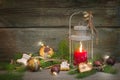 Rustic christmas lantern with candlelights and wooden background