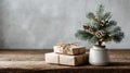 Rustic christmas minimalist scene, decor with mini pine tree and gift boxes on wooden table, empty background Royalty Free Stock Photo