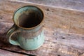 Rustic Clay Mug on a Old Barn Board Floor Royalty Free Stock Photo