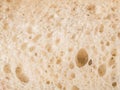 Rustic close-up of sliced bread texture from top view, golden crust wheat loaf Royalty Free Stock Photo