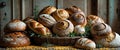A Rustic Collection of Assorted Artisan Breads and Rolls Baked to Perfection Displayed with Wheat. Royalty Free Stock Photo