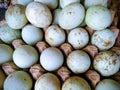 A rustic collection of fresh eggs with natural white and blue-green shells, arranged in a carton. Royalty Free Stock Photo