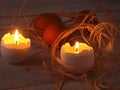 Rustic composition with candles and eggs. Happy easter. Selective focus. Royalty Free Stock Photo