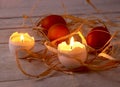 Rustic composition with candles and eggs. Happy easter. Selective focus. Royalty Free Stock Photo