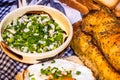 Rustic composition with sausages rolls, fried egg on toast bread, different bowls with sauce and chopped vegetables Royalty Free Stock Photo