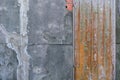 Rustic corrosion iron door on cement wall background Royalty Free Stock Photo