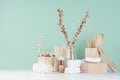 Rustic cosmetic accessories of beige wood for body and skin care - bath sponge, comb, soap, towel, shave brush, dry flowers.