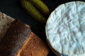 Rustic country bread and French cheese. Royalty Free Stock Photo