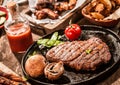 Rustic country meal of grilled rib eye beef steak Royalty Free Stock Photo